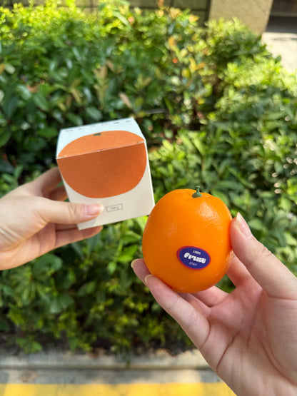 Orange scented candle